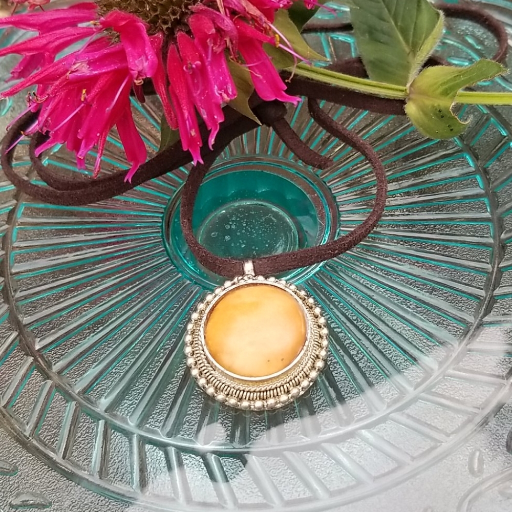 Vintage Enclosed Stone pendant on leather cord